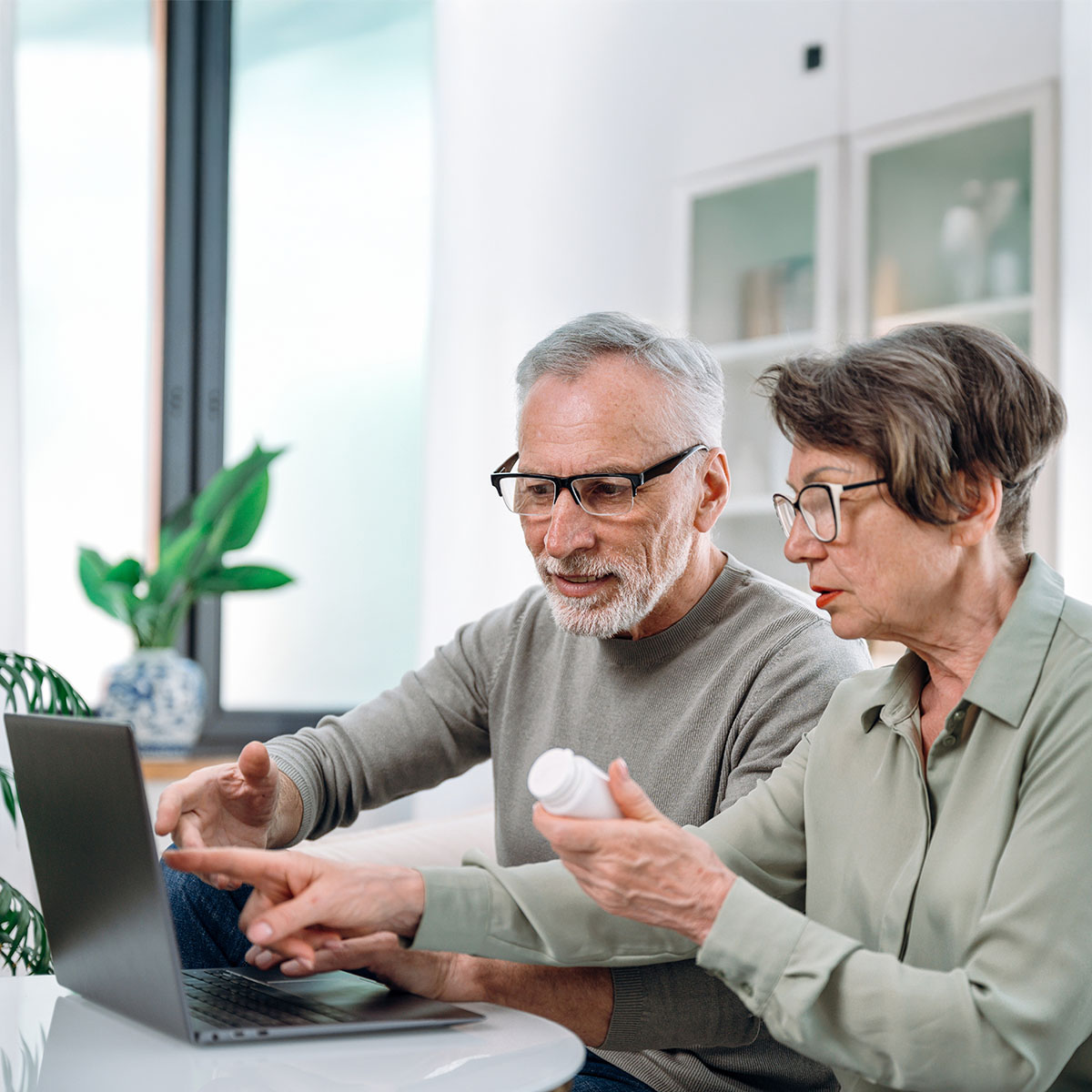 Arizona seniors on a laptop checking when to enroll in Medicare—reviewing IEP, AEP, and Part D enrollment periods.